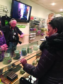 Denver trip: State Sen. Linda Dorcena Forry visits a marijuana distributor in Colorado with other members of the Senate delegation.
